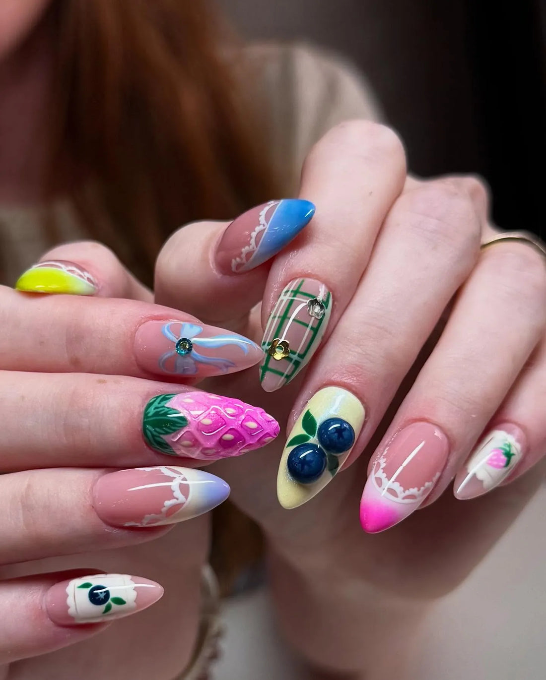 Handmade 3D fruit press-on nails with strawberry, blueberry, lace, and plaid designs.