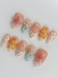Handmade 3D tropical orchid and lily press-on nails with starfish and seashell designs
