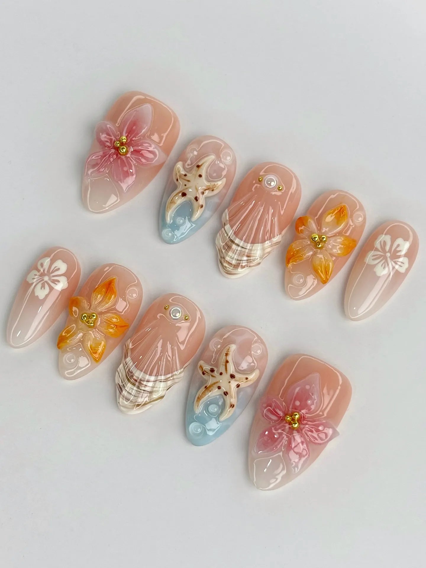 Handmade 3D tropical orchid and lily press-on nails with starfish and seashell designs