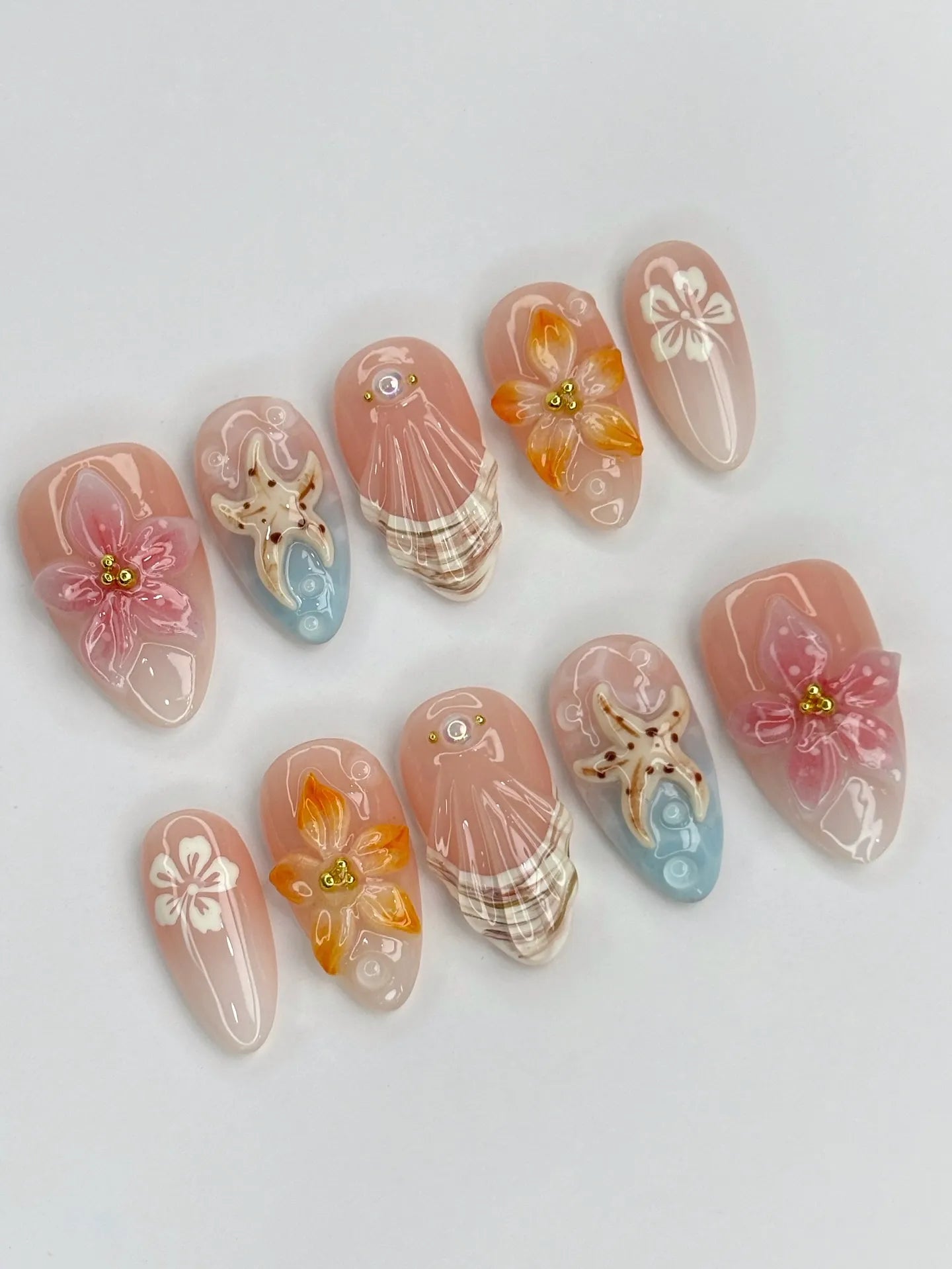 Handmade press-on nails with 3D tropical orchid, lily flowers, seashells, and starfish design