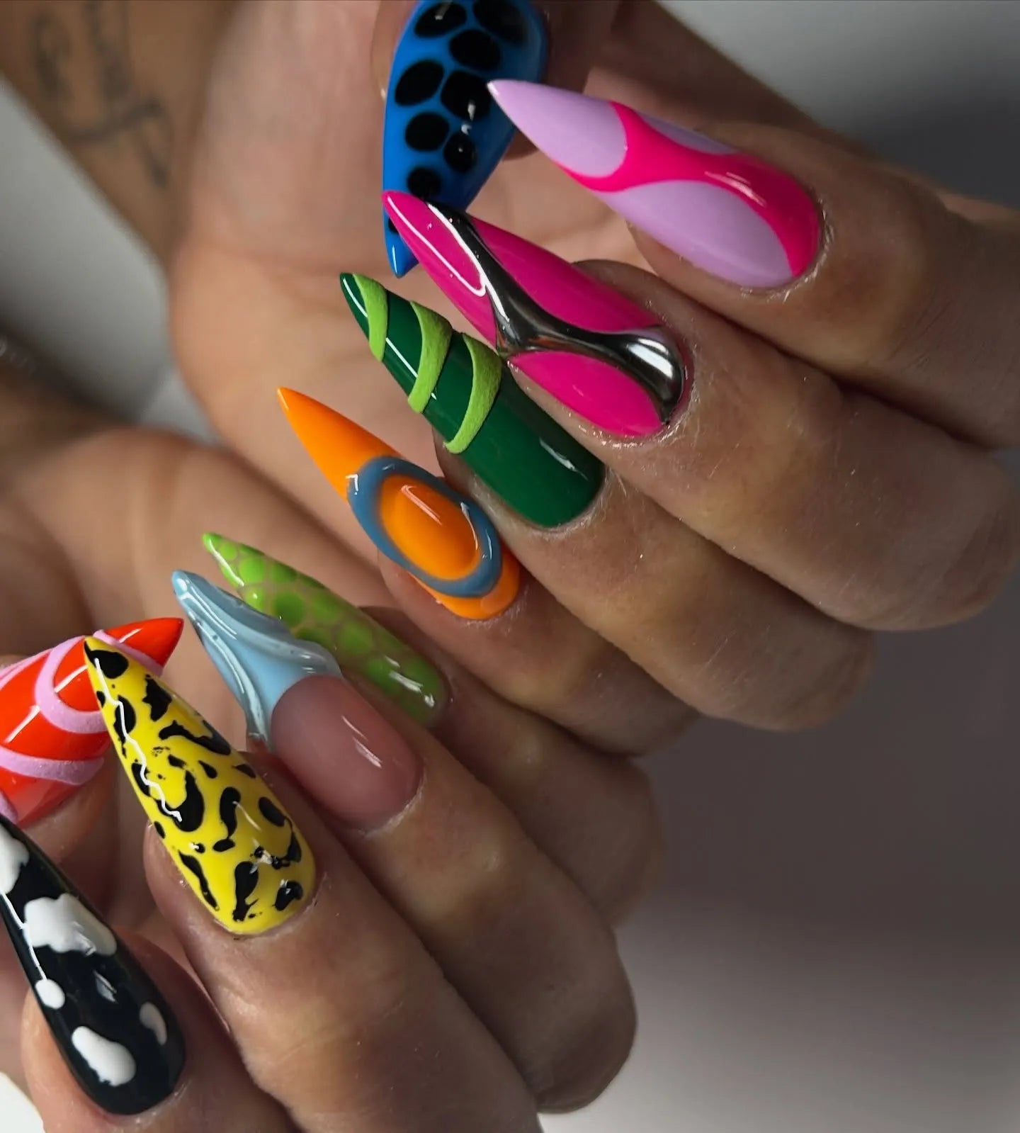 Handmade long stiletto press-on nails with neon, abstract, 3D chrome and animal print designs