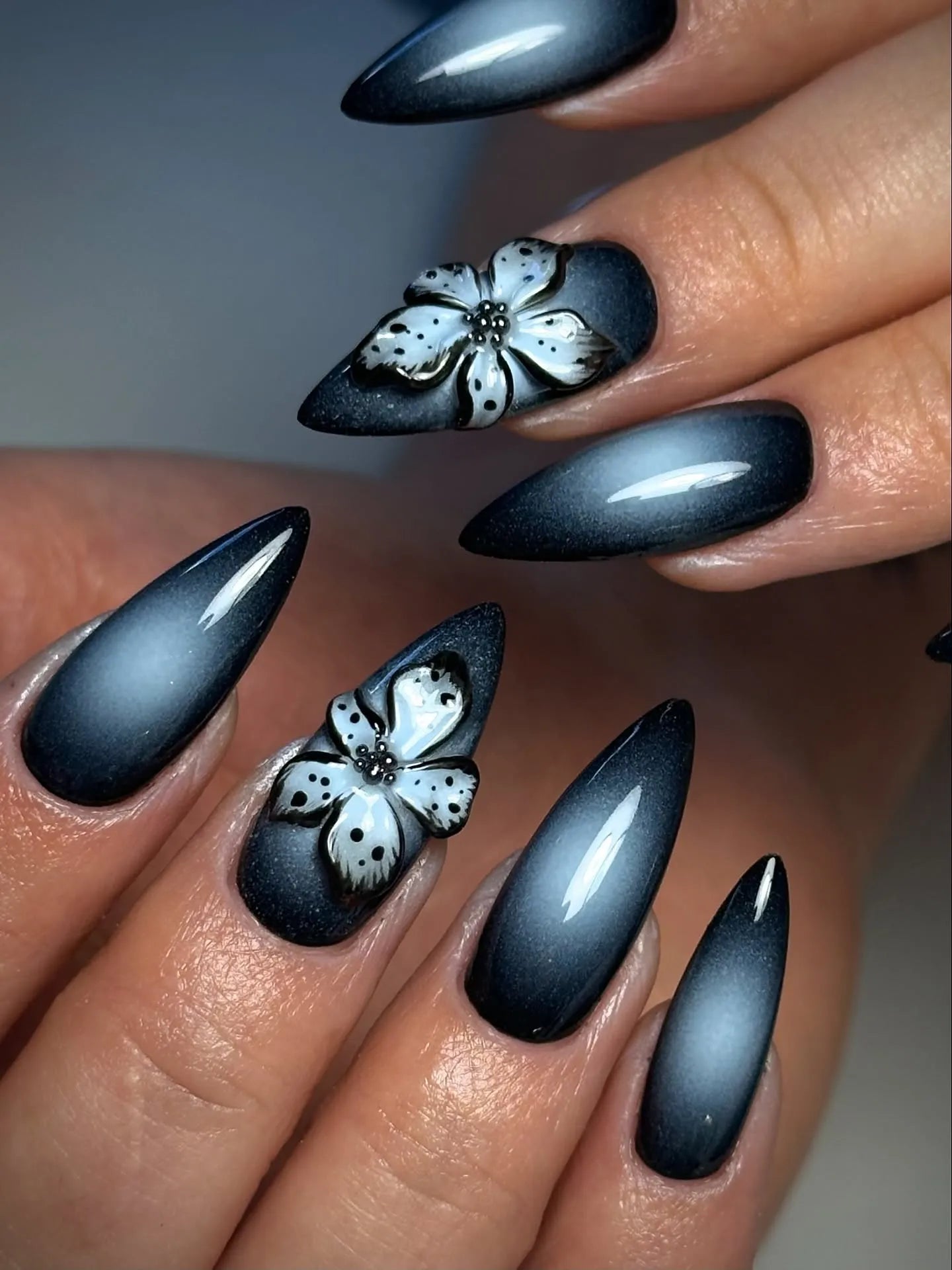 Handmade black ombre press-on nails with 3D floral accents, gothic and chic style
