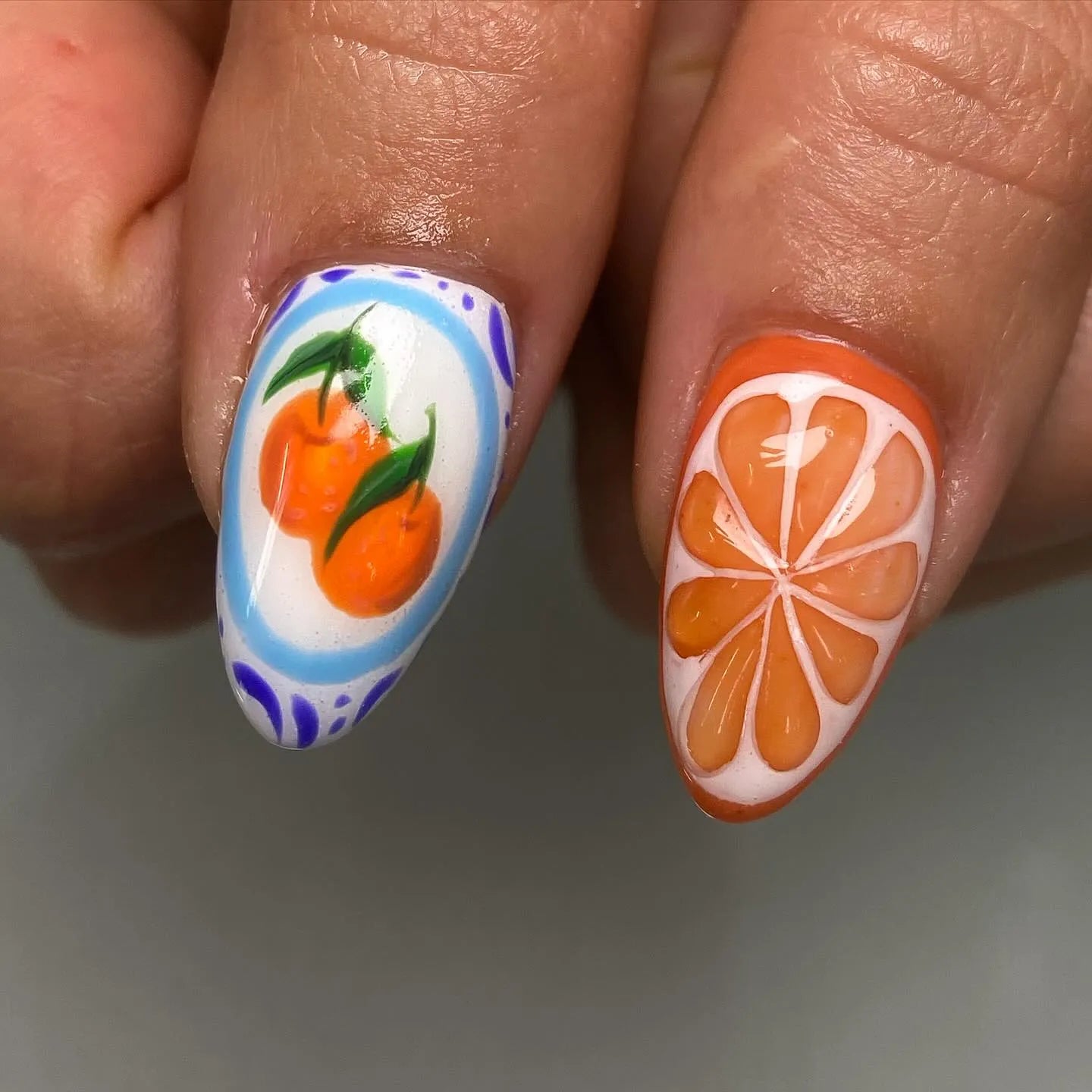 Handmade press-on nails with orange fruit and citrus slice summer design