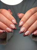 Handmade burgundy lace French tip press-on nails with intricate mandala design.