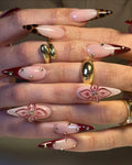 Handmade burgundy red stiletto press-on nails with leopard print tips, 3D floral design, and gold accents.