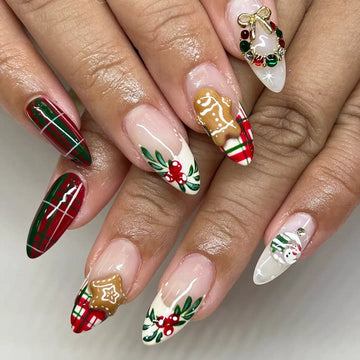 Handmade Christmas press-on nails with plaid, gingerbread, holly, wreath, and snowman designs