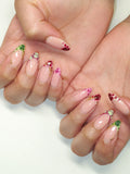 Handmade French tip press-on nails with colorful reptile print and gold accents