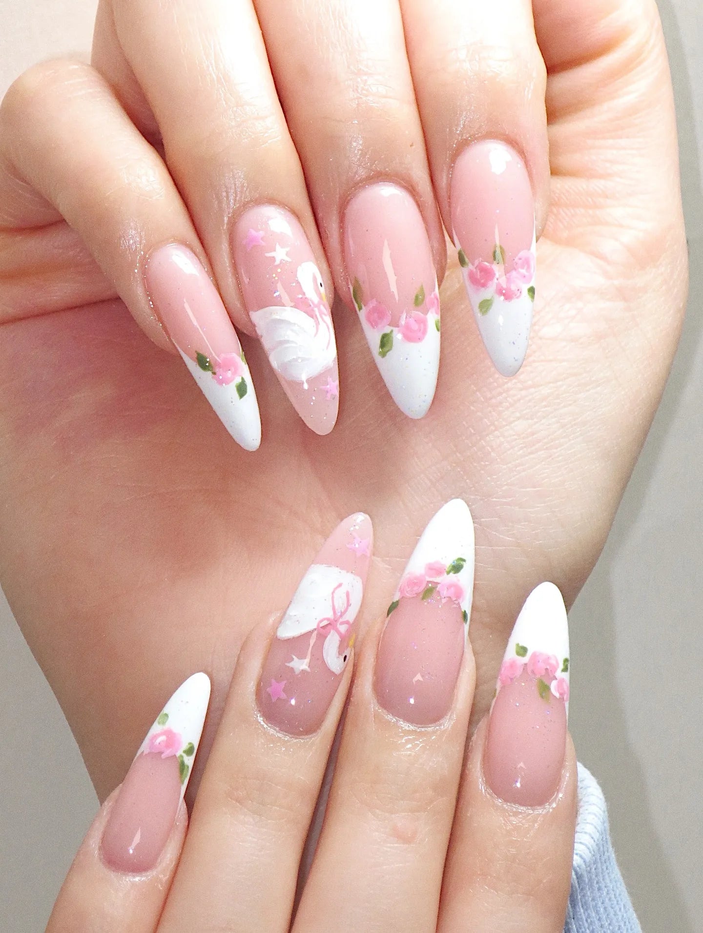Handmade press-on nails with white swan, pink rose floral art, and balletcore design.