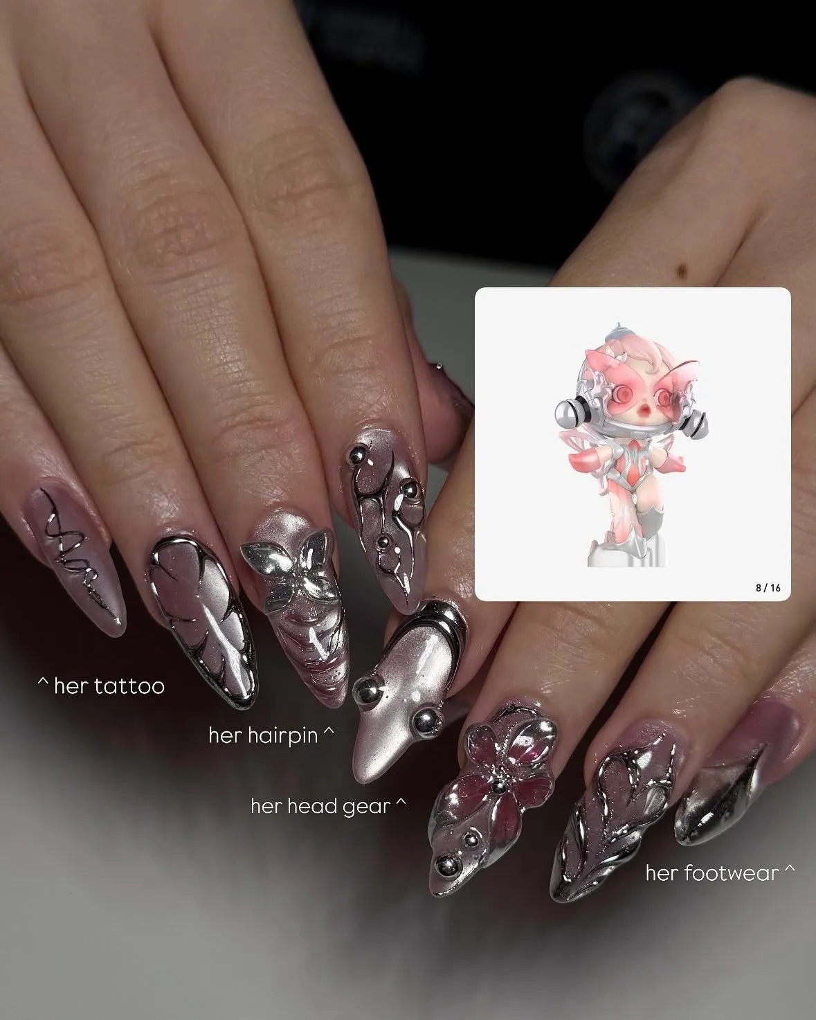 Hand with stiletto press-on nails, chrome pink metallic 3D flower cyber design, close-up