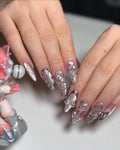 Handmade chrome pink stiletto press-on nails with 3D metallic flower nail art design.