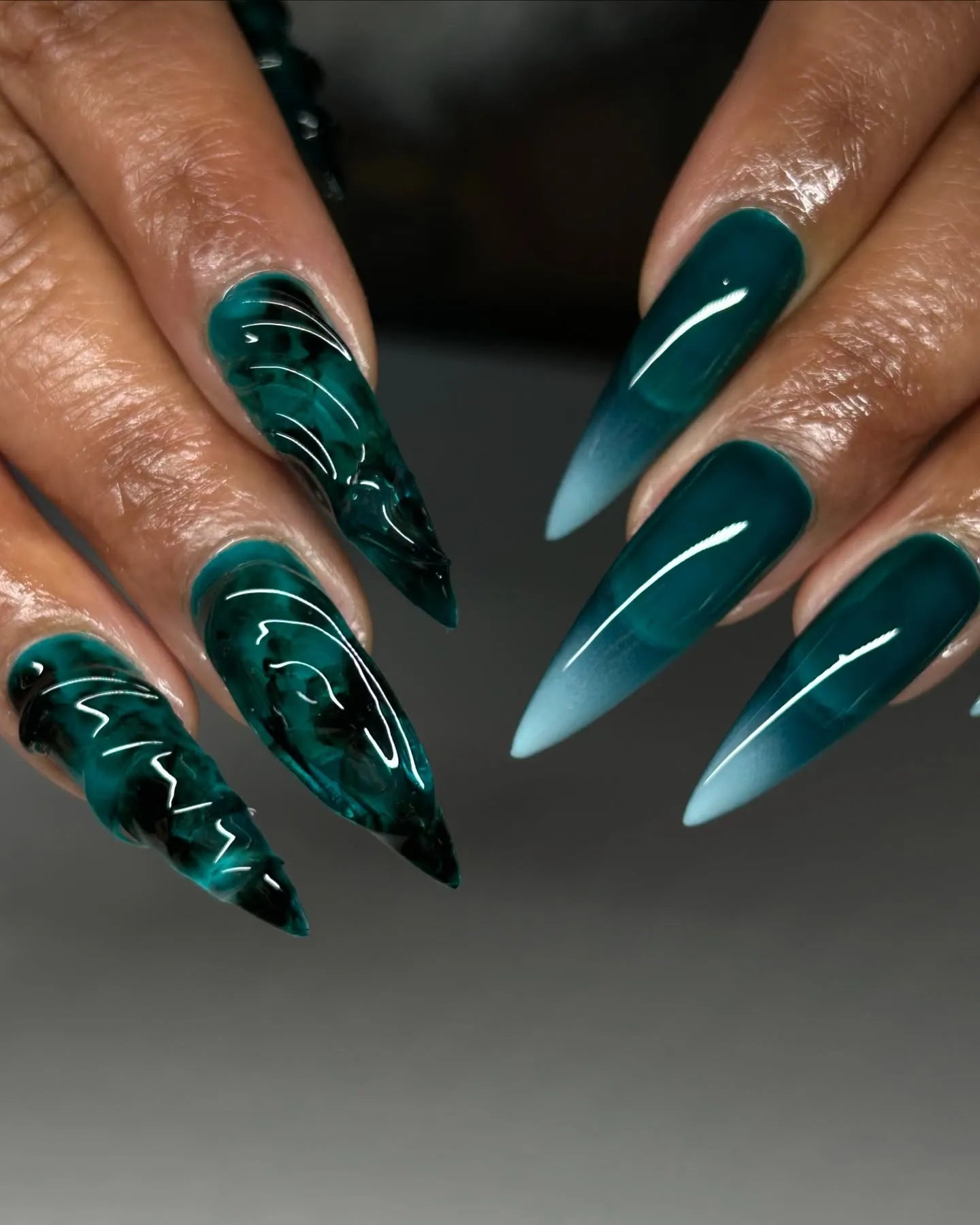 Handmade emerald green stiletto press-on nails with 3D sea glass texture and gradient effect.