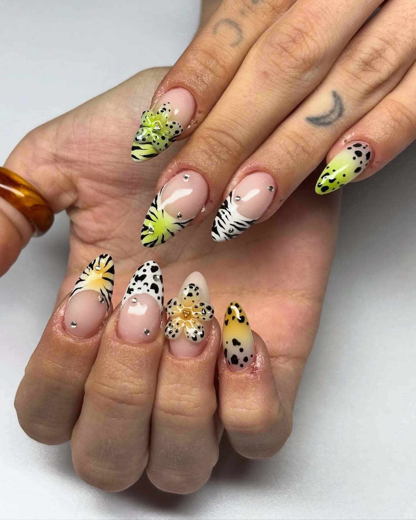 Handmade press-on nails with floral, leopard, and zebra patterns plus crystal accents