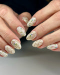Handmade press-on nails with gold trellis design and delicate vintage floral accents