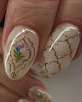 Handmade press-on nails with gold trellis pattern and vintage floral accents
