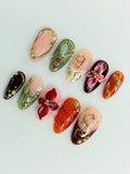 Handmade press-on nails with red, green, gold filigree, 3D floral and marble designs