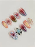 Handmade iridescent 3D floral press-on nails with pastel ombre and speckled design