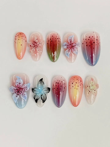 Handmade iridescent 3D floral press-on nails with pastel ombre and speckled design
