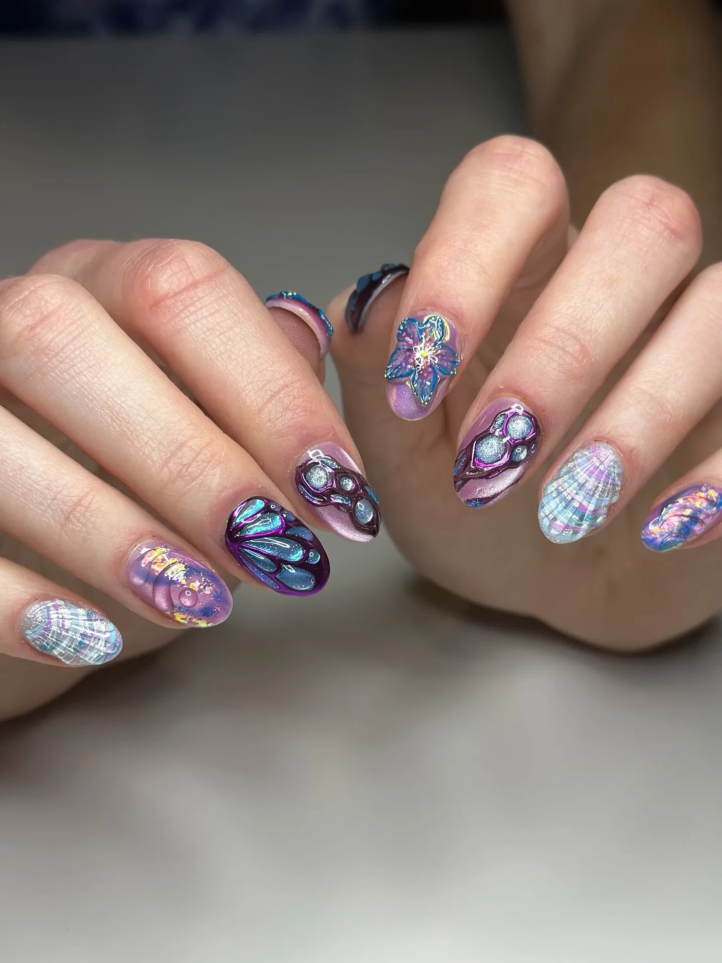 Handmade iridescent butterfly and shell 3D fantasy press-on nails with multicolor designs