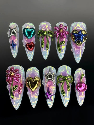 Handmade iridescent press-on nails with 3D metallic hearts, stars, bows, flowers, and cherries