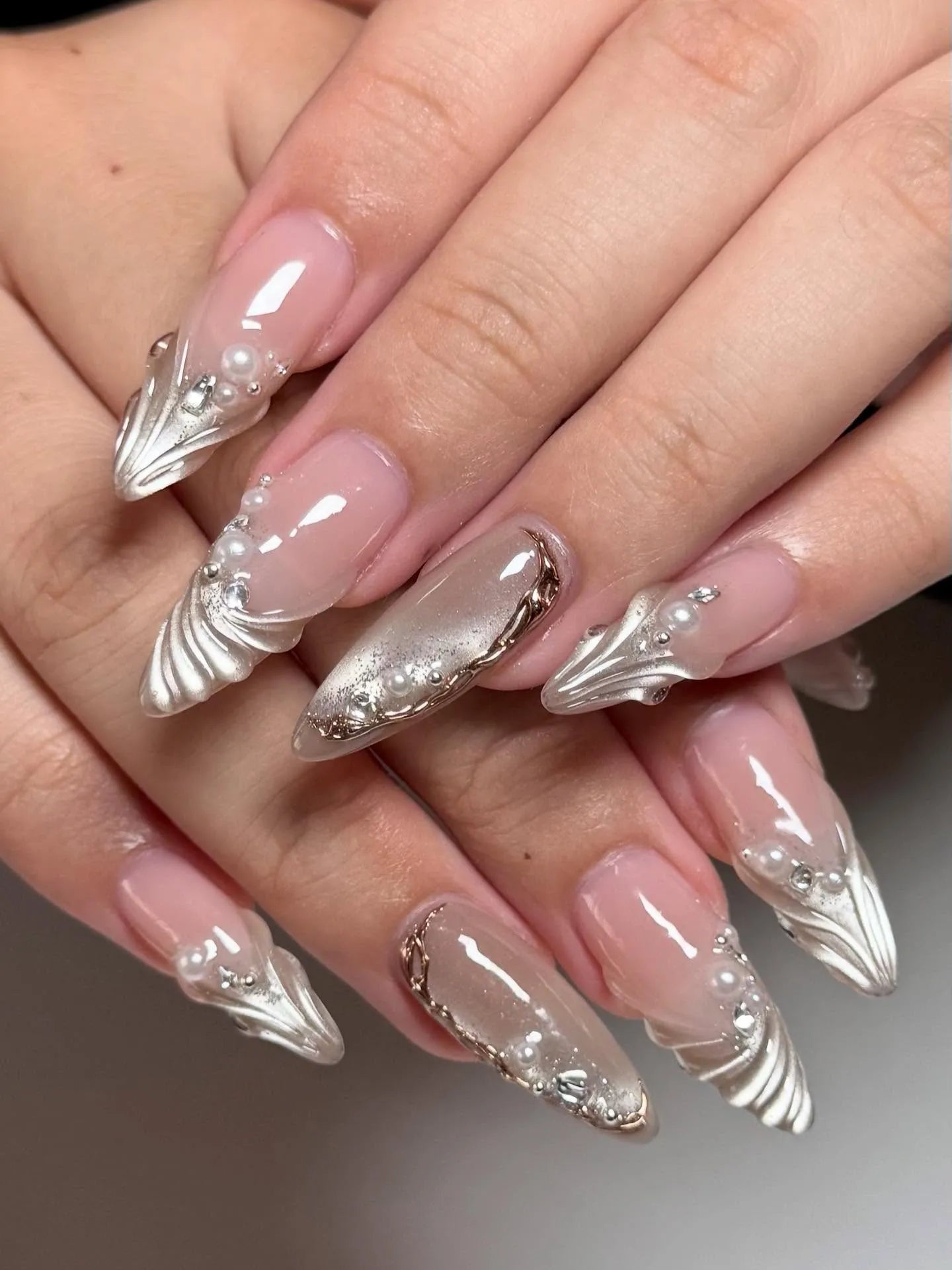 Handmade iridescent shell 3D pearl French tip press-on nails with elegant, glossy finish.