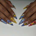 Handmade stiletto press-on nails with lemon, blue, white, and Mediterranean-inspired designs