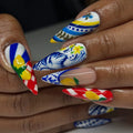 Handmade stiletto press-on nails with Mediterranean lemon and blue Talavera tile designs