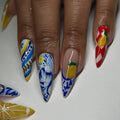 Handmade stiletto press-on nails with Mediterranean lemon and blue white Talavera designs.