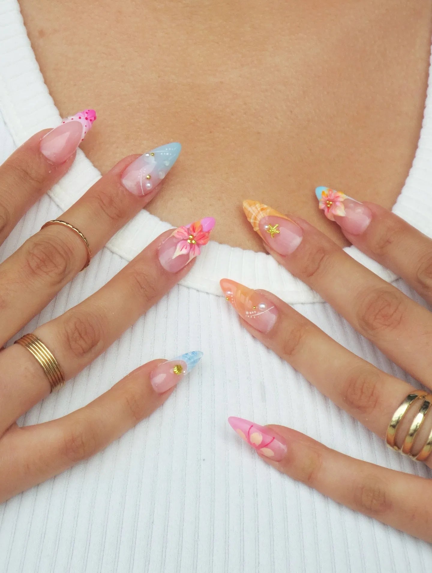 Handmade mermaid shell press-on nails with tropical floral, pearl, and 3D ocean designs