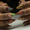 Handmade press-on nails with monarch butterfly wings, crystals, gold accents, and jewel art.