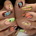 Handmade press-on nails with monarch butterfly design, crystals, and luxury jewel accents