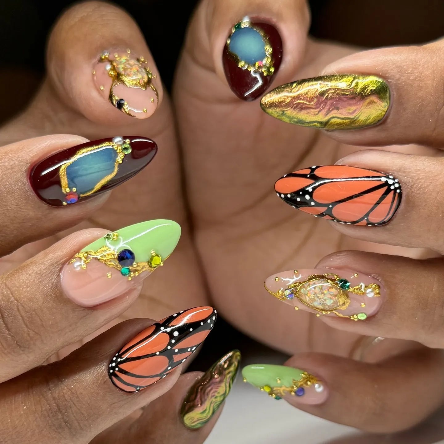 Handmade press-on nails with monarch butterfly design, crystals, and luxury jewel accents
