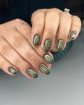Handmade olive green press-on nails with gold botanical designs and glossy finish