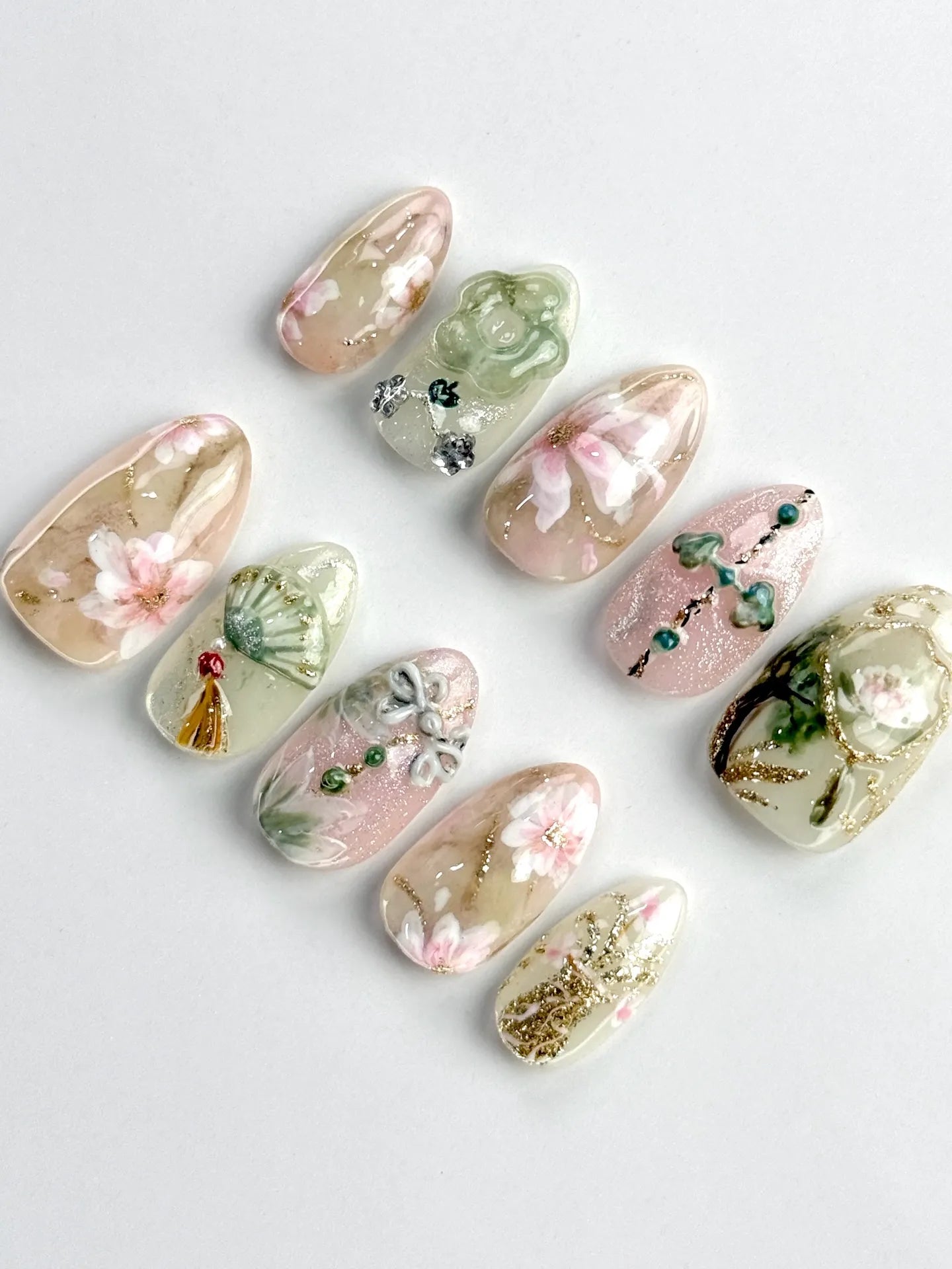 Handmade oriental press-on nails with floral jade fan designs and gold shimmer accents