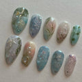 Handmade pale blue press-on nails with ocean, jellyfish, water lily designs and silver accents