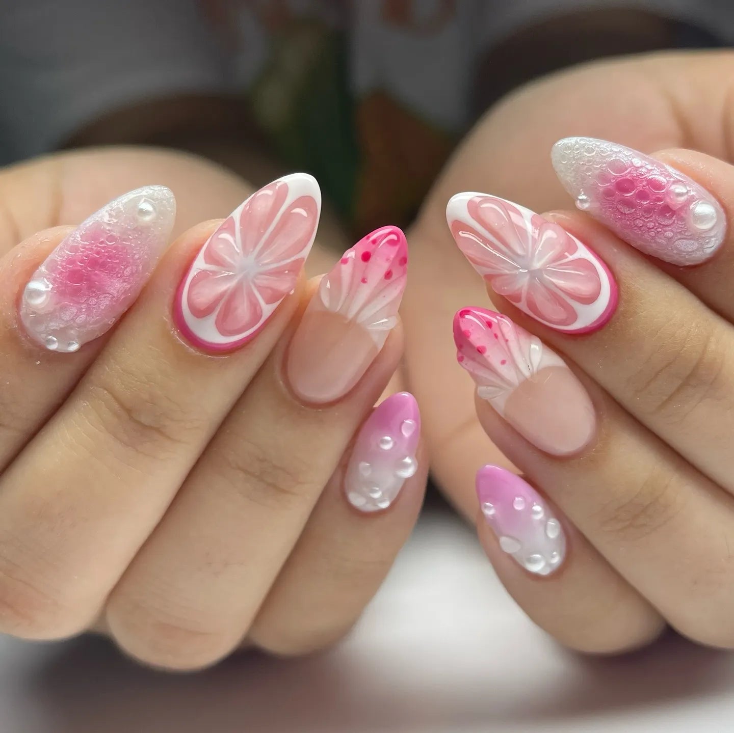 Handmade pink 3D citrus blossom press-on nails with pearl and bubble accents