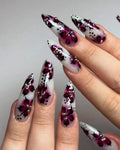 Handmade long press-on nails with pink butterfly floral art and rhinestone accents, elegant style