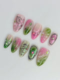 Handmade pink and green fairycore butterfly wing press-on nails with chrome details and gems