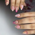 Handmade pink floral shell press-on nails with gold leaf accents and pearl details