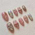 Handmade pink and silver chrome press-on nails with 3D flower, jewel, and glamour charms.