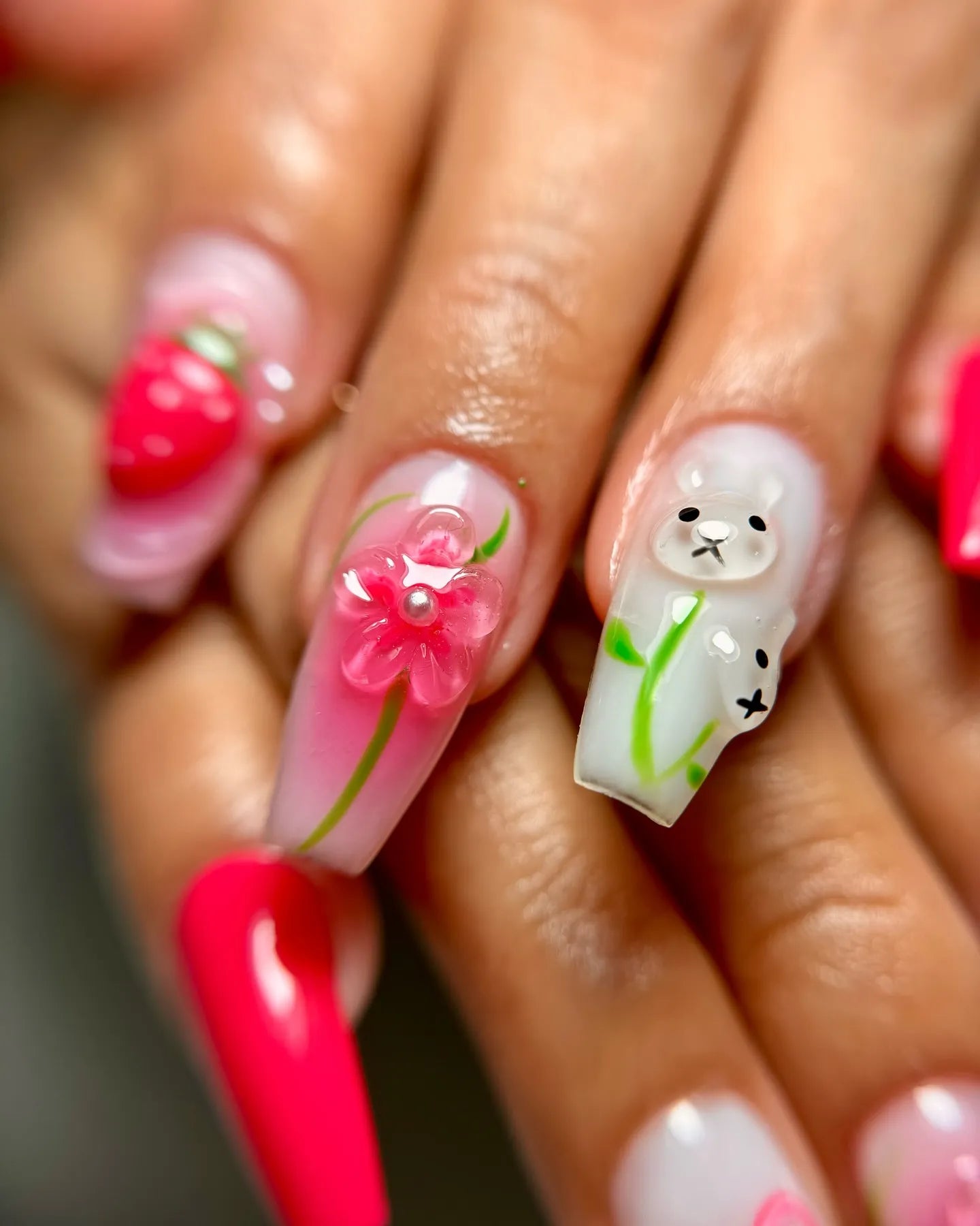 Handmade press-on nails with 3D pink strawberry, bunny, and flower nail art design.