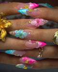 Handmade pink and teal press-on nails with 3D floral, seashell, pearl, and gold accents