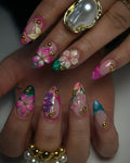 Handmade press-on nails with 3D pink, teal, and green floral designs and gold accents