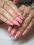 Handmade pink zebra French tip press-on nails with 3D floral and gem accents