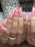 Handmade pink zebra French tip press-on nails with 3D floral and gem accents