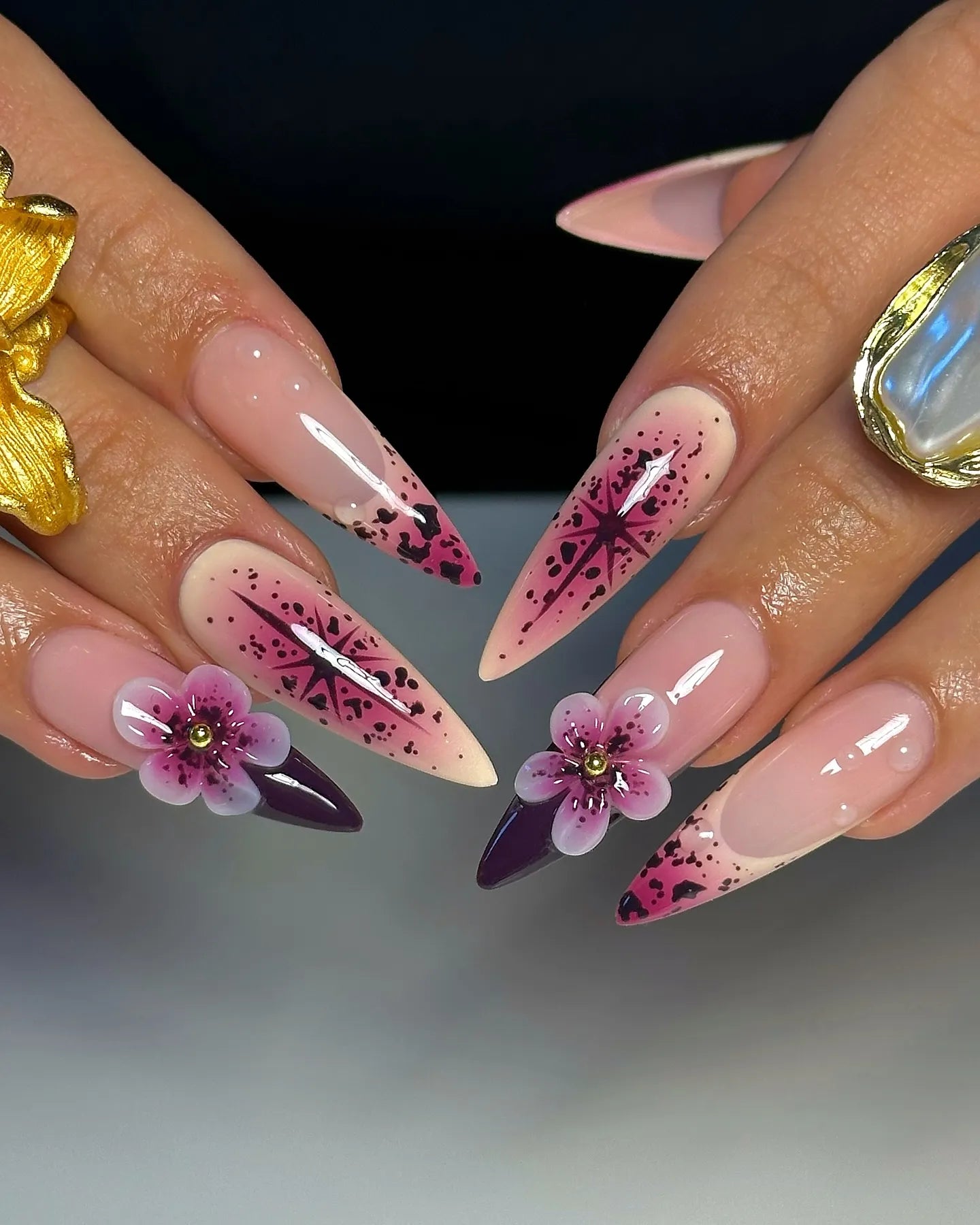 Handmade purple floral press-on nails with 3D flowers and celestial galaxy star art