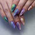Hand with almond-shaped, multicolor rainbow shimmer press-on nails, velvet cat eye effect
