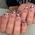 Handmade press-on nails with red cherry and black cow print animal pattern design