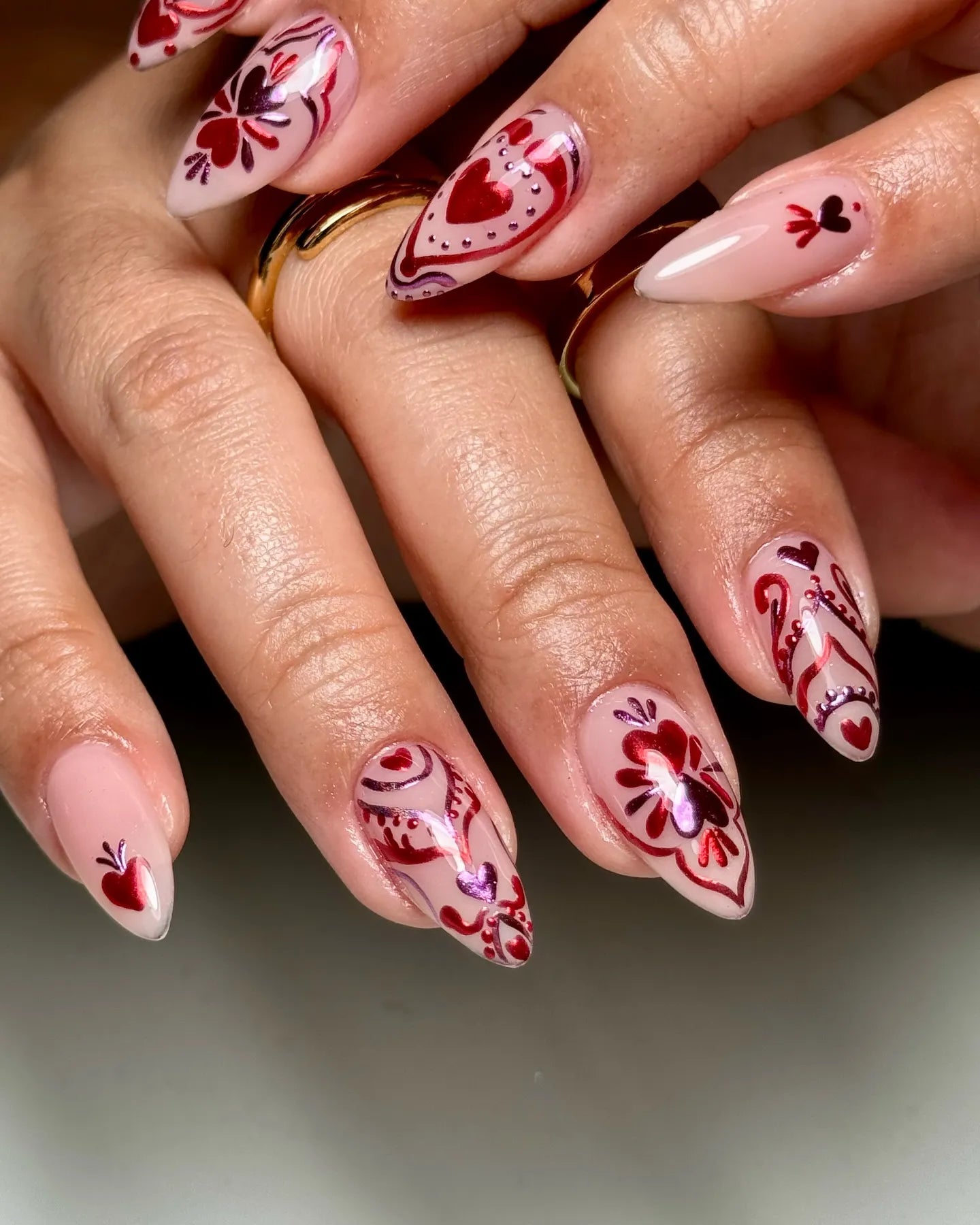 Handmade red and pink folk art heart Valentine press-on nails with floral designs
