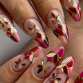 Handmade press-on nails with red mosaic floral design and gold outlines, almond shape