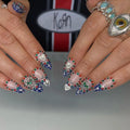 Handmade royal blue ombre heart press-on nails with silver chrome and gemstone accents
